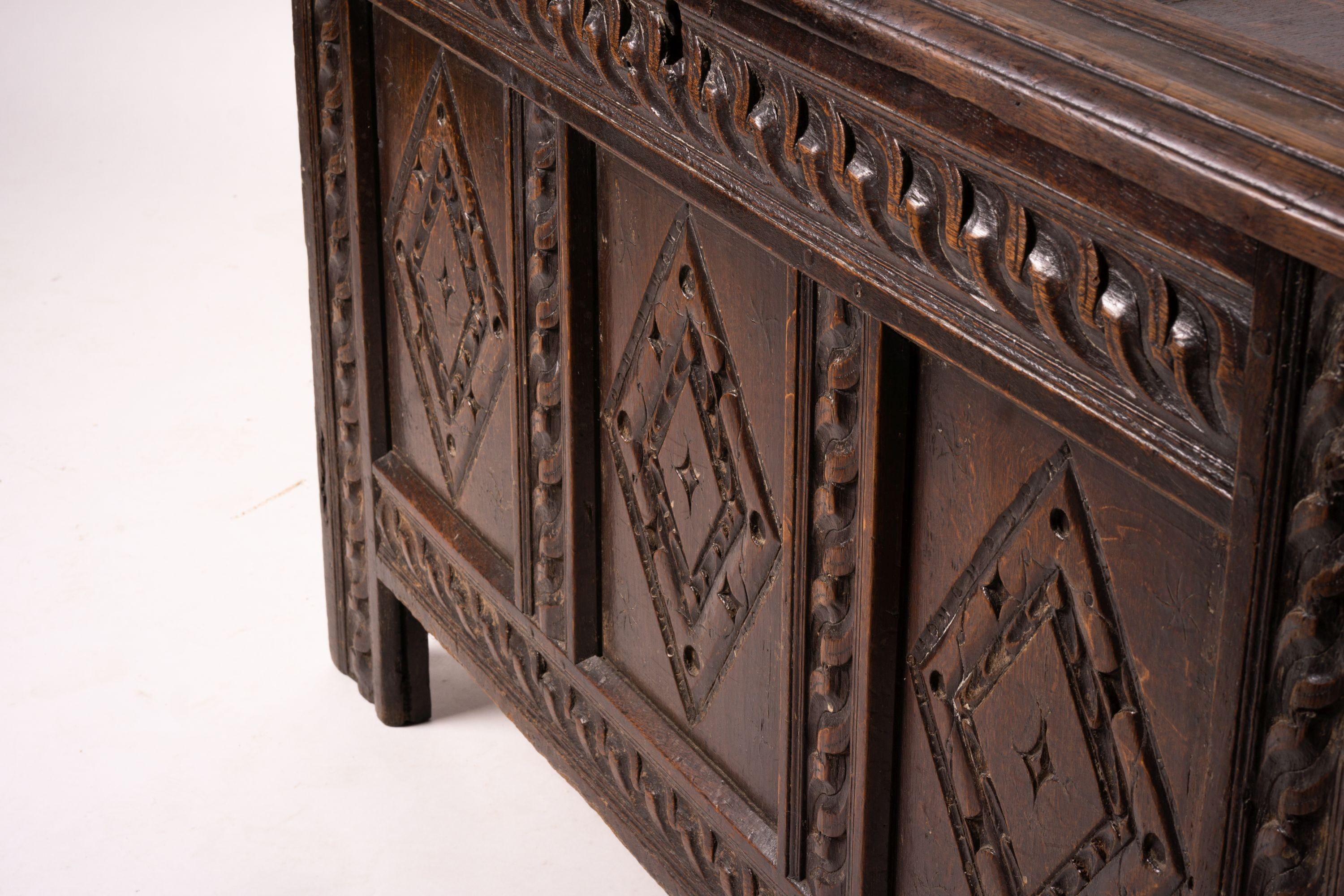 A 17th century carved panelled oak coffer, length 115cm, depth 56cm, height 67cm